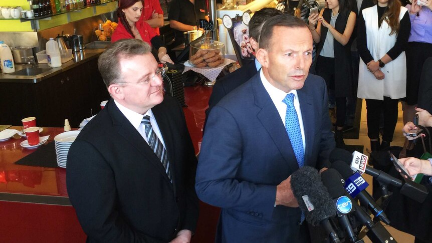 Bruce Billson and Tony Abbott talk to the media on May 21, 2015