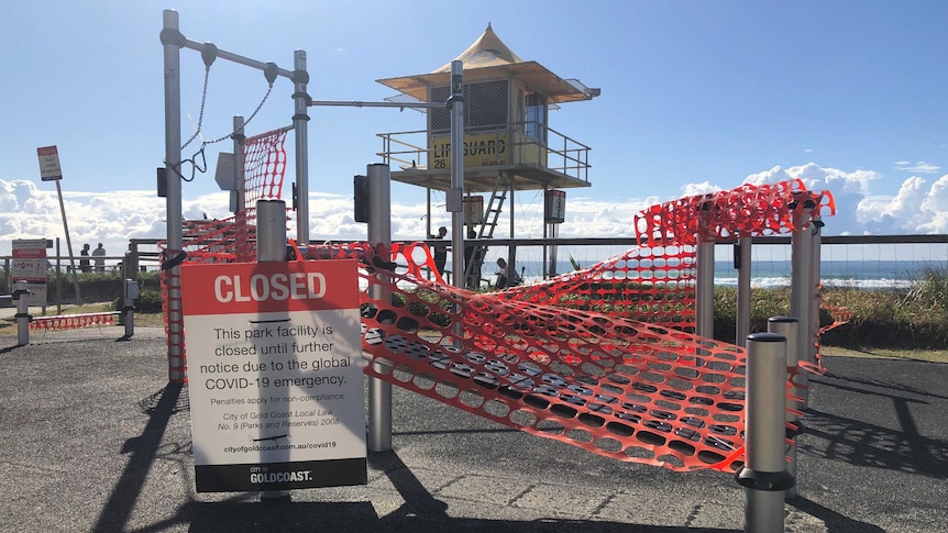 An outdoor gym festooned with warning tape.