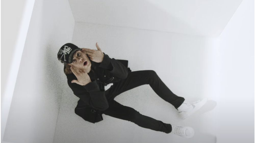 Still from The Kid LAROI's 'Tell Me Why' video, The Kid LAROI in a white cube