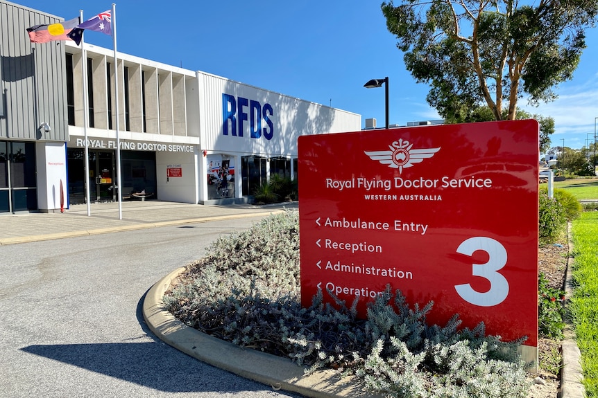 A photo of a building with a sign that reads Royal Flying Doctor Service 