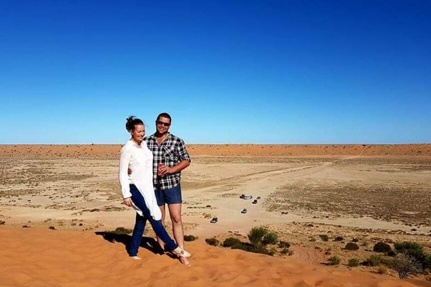 Jason and Elizabeth Docherty stand in the Simpson Desert in Queensland