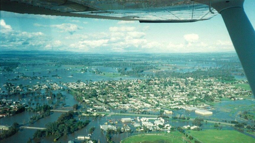An taerial shot from a plane of a town with floodwater through it