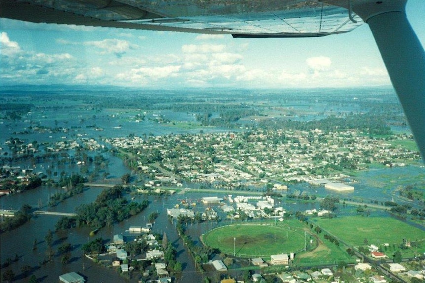 An taerial shot from a plane of a town with floodwater through it