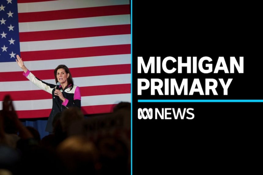 Michigan Primary: Nikki Haley delivers a campaign speech at a rally in front of an American Flag backdrop