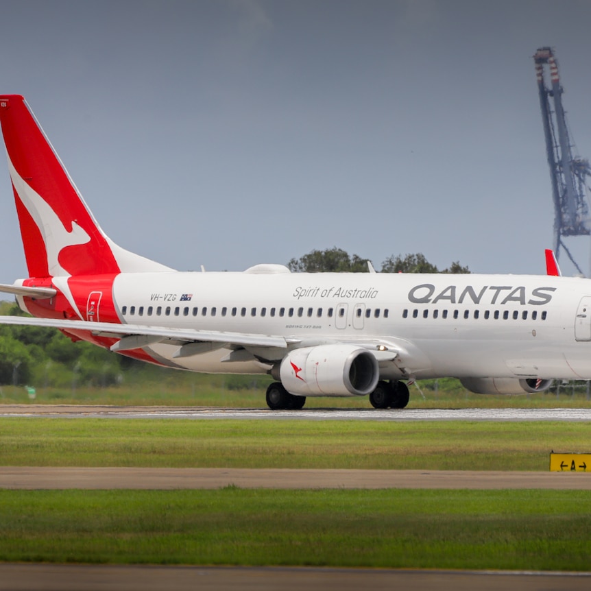 Qantas plane on the runway at Brisbane airport