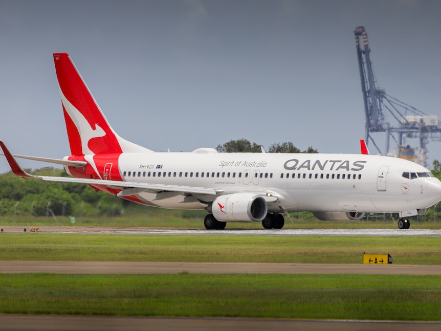 Qantas plane on the runway at Brisbane airport