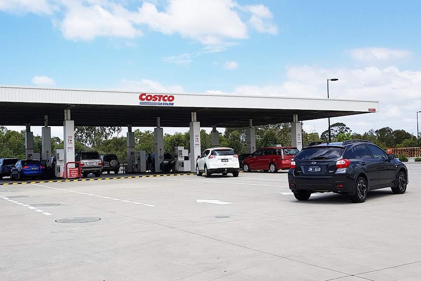 Cars fill up at Costco petrol station at North Lakes, north of Brisbane on October 9, 2017