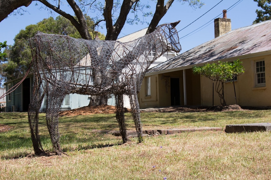 Steel sculpture of a cow at the dairy
