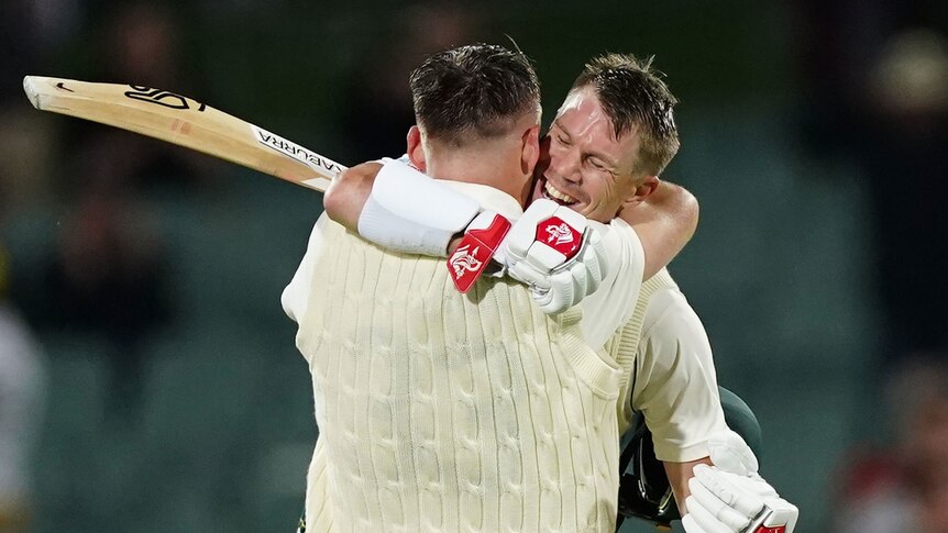 Marnus Labuschagne and David Warner hug