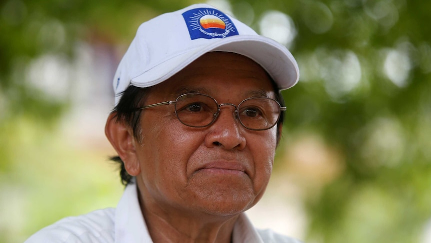 Cambodia's opposition leader Kem Sokha wearing a white cap.