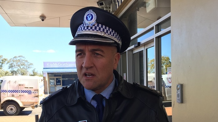 A high-ranking police officer outside a police station