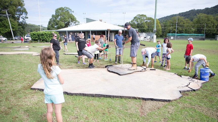 The community has banded together in Bilambil to clear asphalt from the oval.