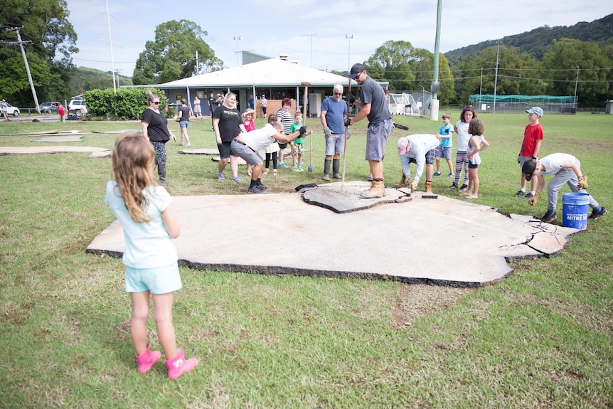 The community has banded together in Bilambil to clear asphalt from the oval.