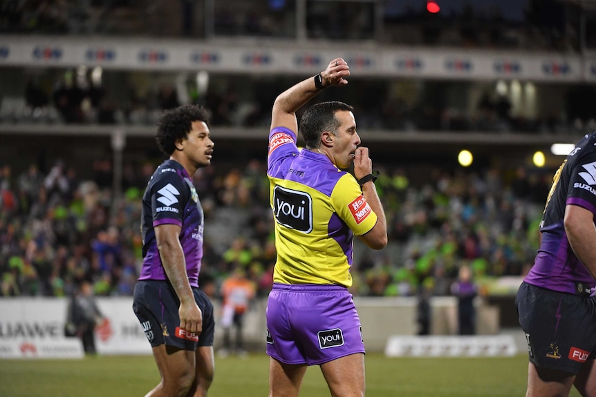 Matt Cecchin officiates during the NRL clash between Canberra and Melbourne