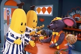 The Bananas in Pyjamas in Rat-in-a-Hat's Cafe.