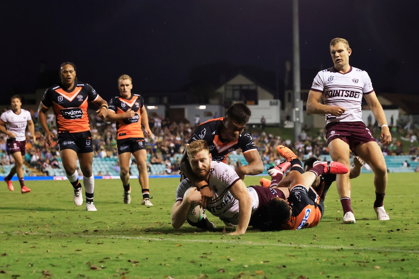 Brad Parker slides over to score against Wests Tigers 