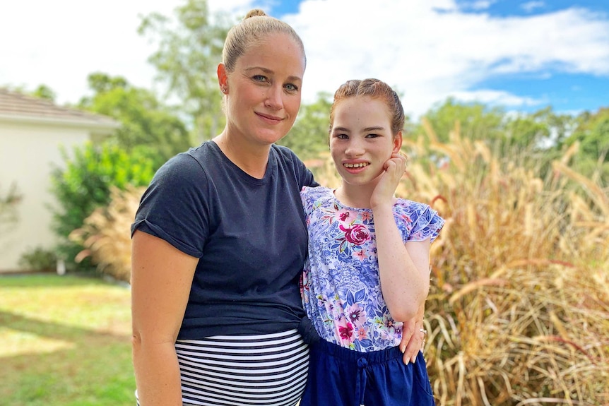 Laura Richards has her arm around daughter Kayla