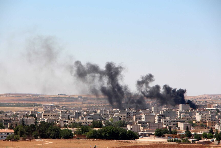 Smoke billows from Kobane