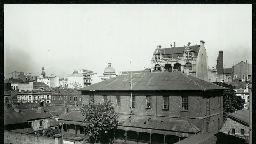 A black and white photo of an old school building