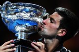 Epic battle ... Novak Djokovic kisses the trophy after beating Rafael Nadal (ABC News: Tony Trung)