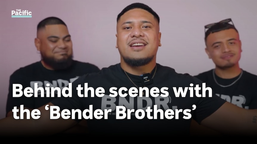 Three young Polynesian men stand infront of pink background. Text reads 'Behind the scenes with the Bender Brothers'