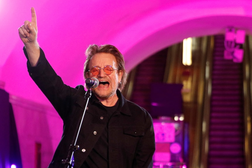 U2 frontman Bono sings during a performance