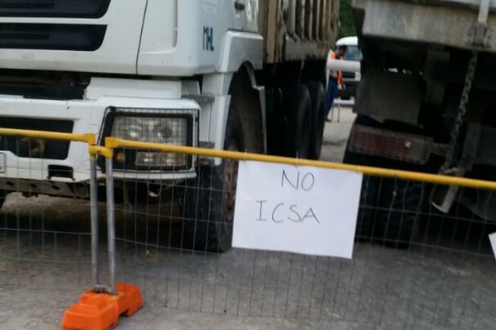 Protestors display sign saying No ICSA (PNG Immigration and Citizenship Service Authority) at their blockade.