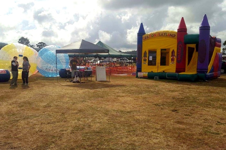 Large plastic balls and a large plastic jumping castle