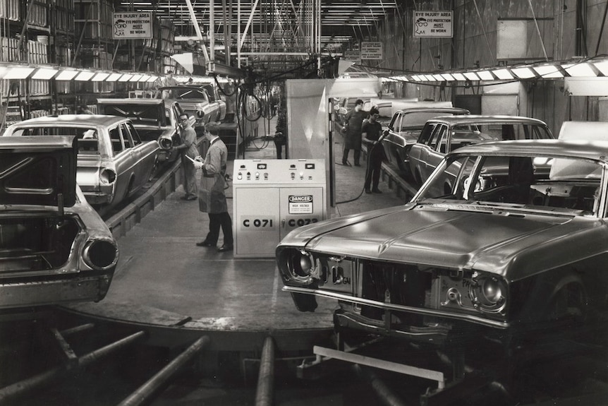 Cars on a conveyor belt at the Broadmeadows Ford plant, where the JFK limousine was repainted.