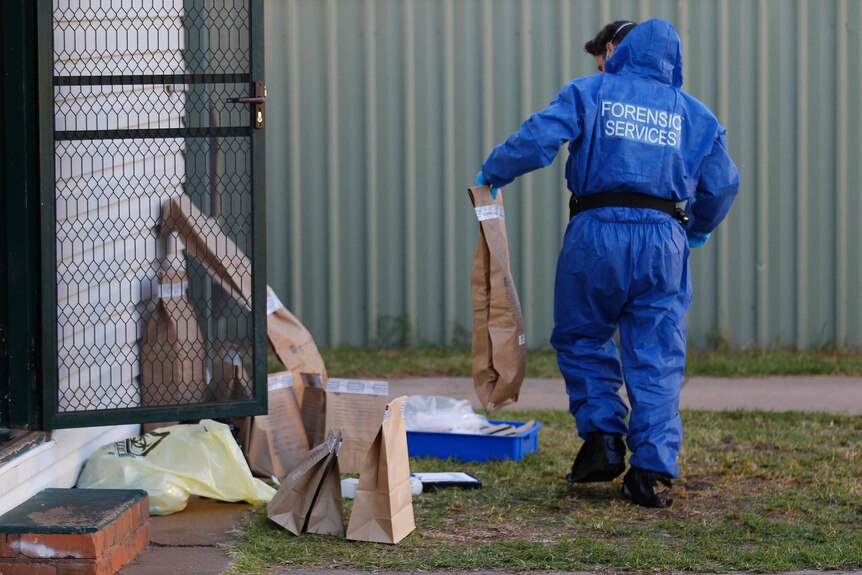 Forensics team search a property in the town of Leeton