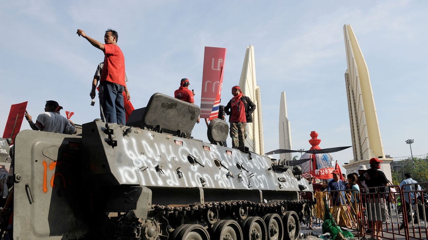 Red Shirt stronghold: protesters stand on top of an armoured vehicle abandoned by soldiers