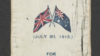 A photo of a frayed ribbon that says "Australia Day for Australia's Heroes".