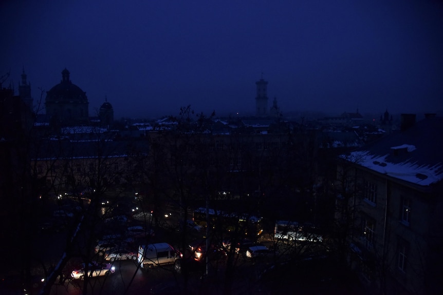 A view showing a city covered in darkness with the buildings barely visable.