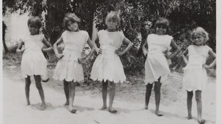 Old photo of five Aboriginal girls in white dresses
