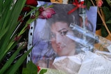 Flowers and messages are seen outside the home of Amy Winehouse in London