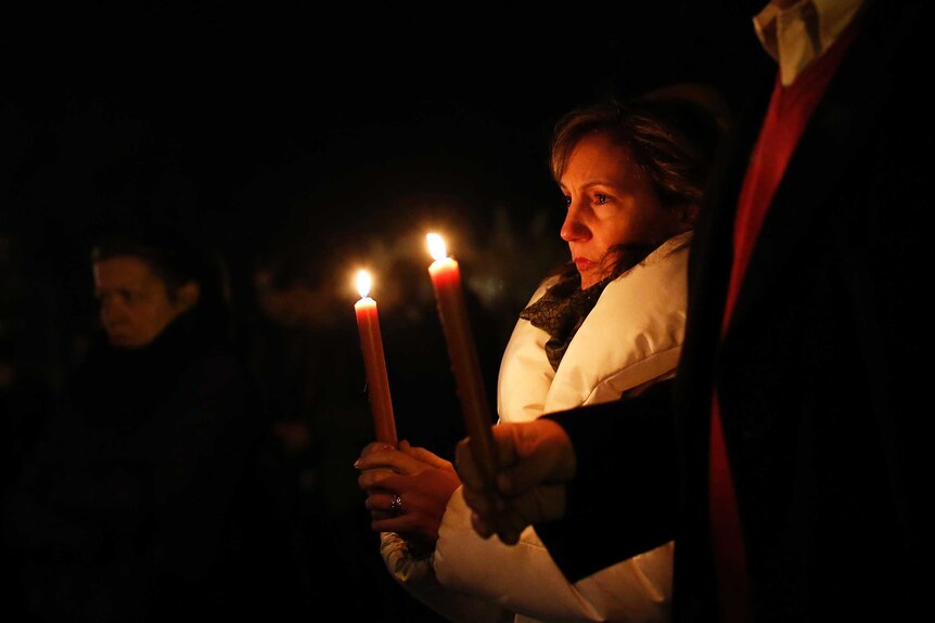 Candlelit vigil in wake of US shooting