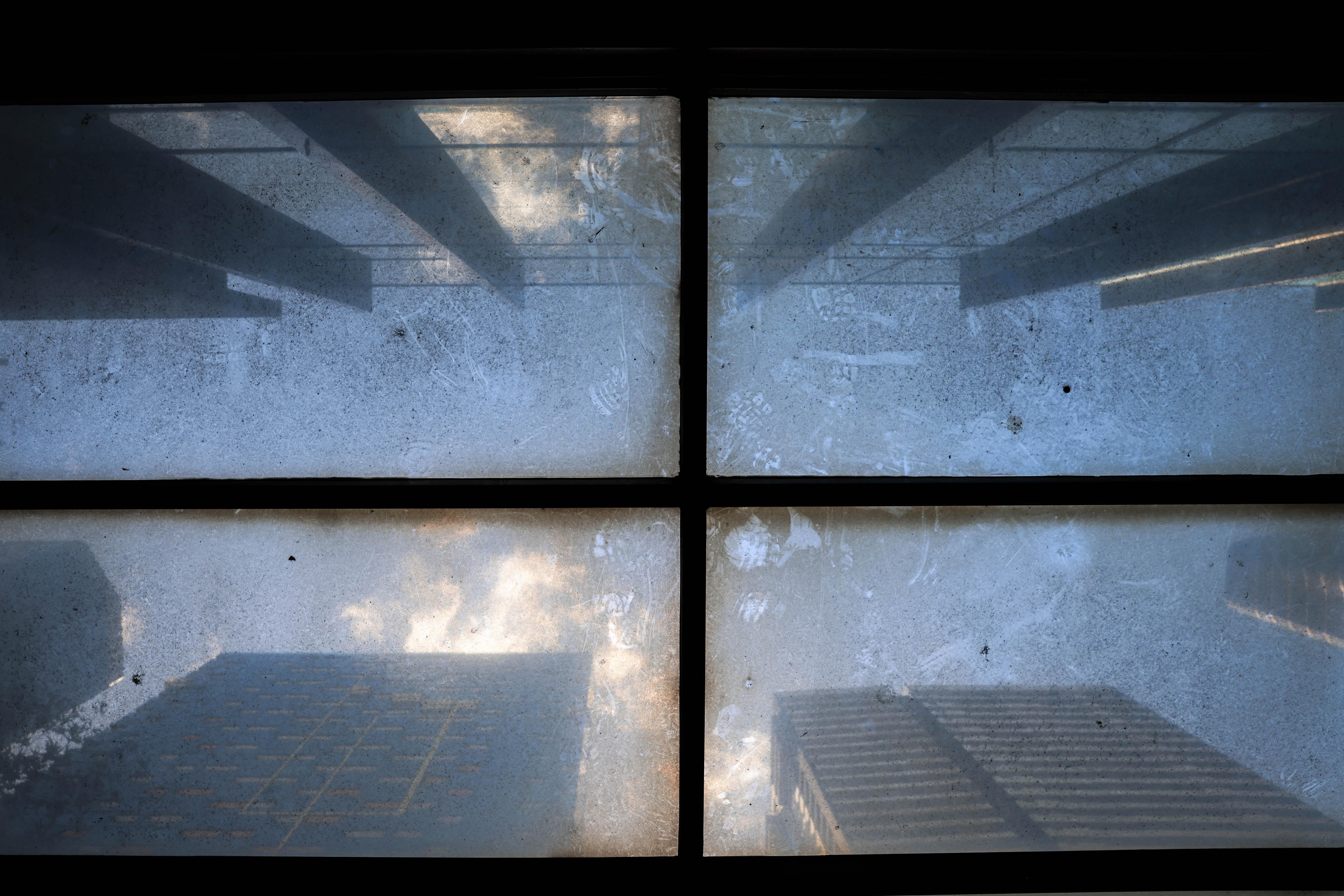 A soot-stained roof on a bus stop