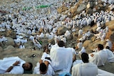 Muslim pilgrims climb Mount Arafat