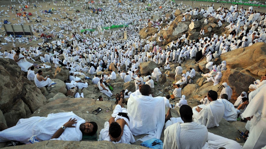 Muslim pilgrims climb Mount Arafat