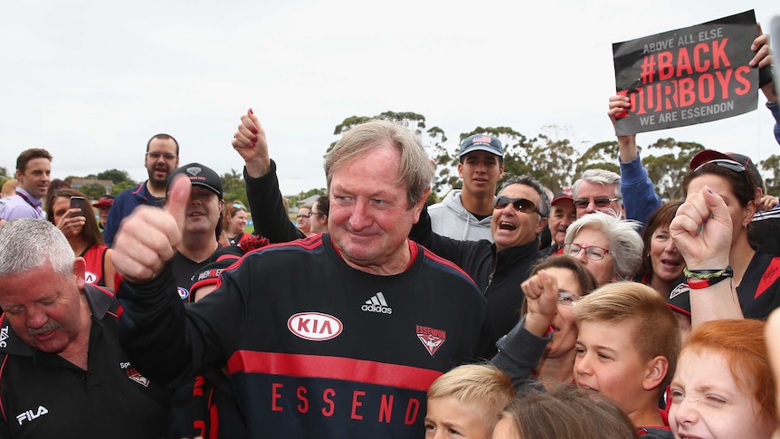 Show of faith ... Kevin Sheedy poses with fans during a Bombers training session on Thursday