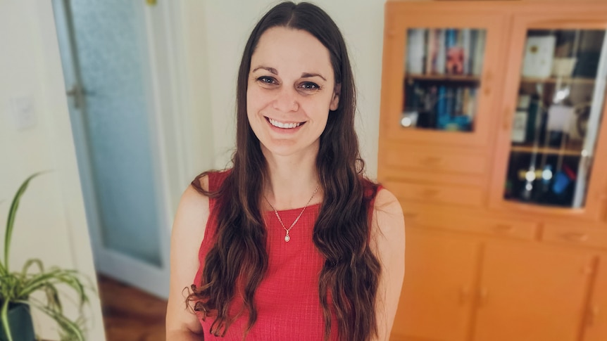 Woman inside the Adelaide home she recently bought and renovated simply, in the living room.