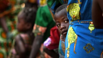 A boy looks out from a line in Kabo in the northern Central African Republic