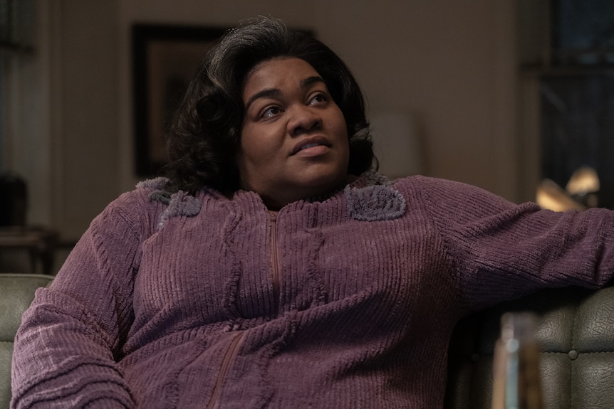 A film still of Da'Vine Joy Randolph, a Black woman in her late 30s, wearing a purple blouse.