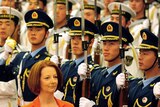 Prime Minister Julia Gillard walks beside Wen Jiabao during a review of the honour guard