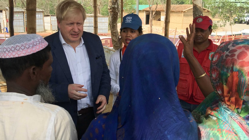 British Foreign Secretary Boris Johnson talks to Rohingya Muslim refugees from Myanmar at Kutapalong camp in Bangladesh.