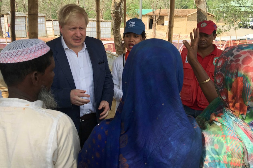 British Foreign Secretary Boris Johnson talks to Rohingya Muslim refugees from Myanmar at Kutapalong camp in Bangladesh.