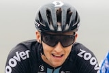 A Team DSm cyclist riding in the 2021 Giro d'Italia.