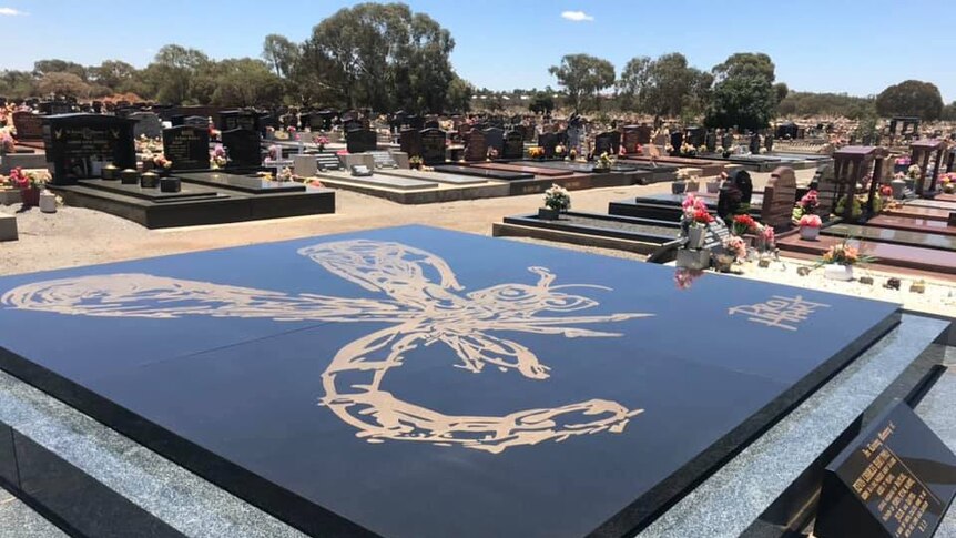 Outback artist Pro Hart's grave in the Broken Hill cemetery.