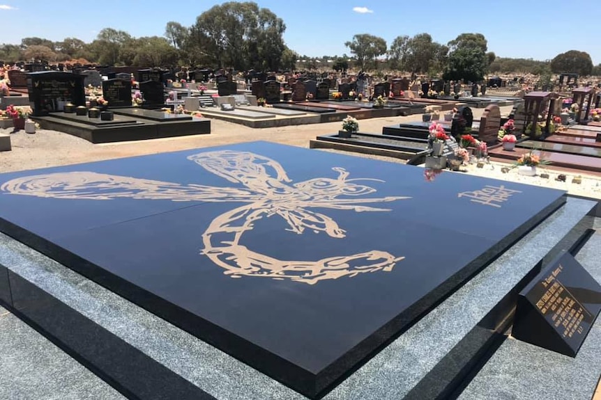 Outback artist Pro Hart's grave in the Broken Hill cemetery.