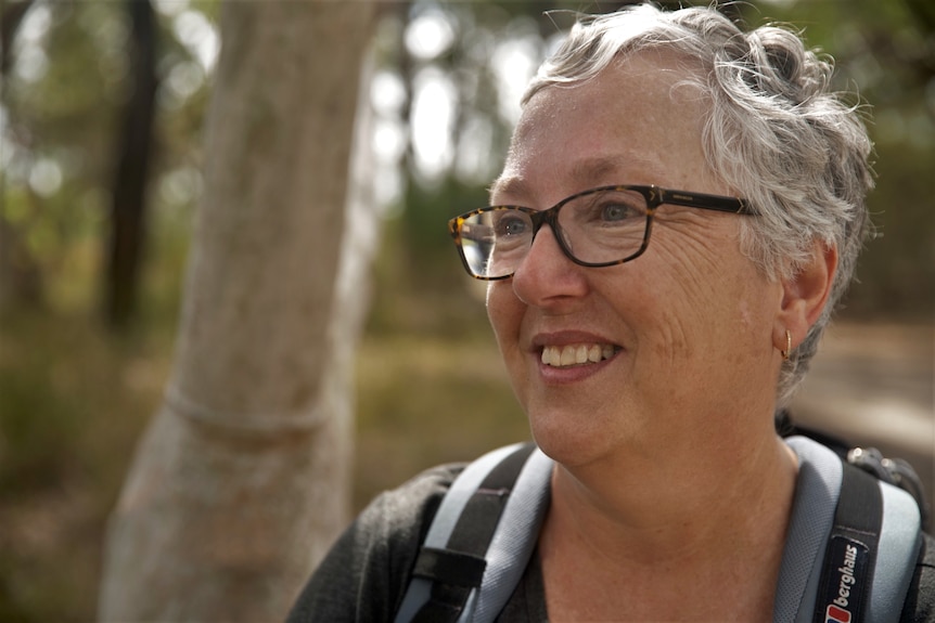 Woman smiling while outdoors. 